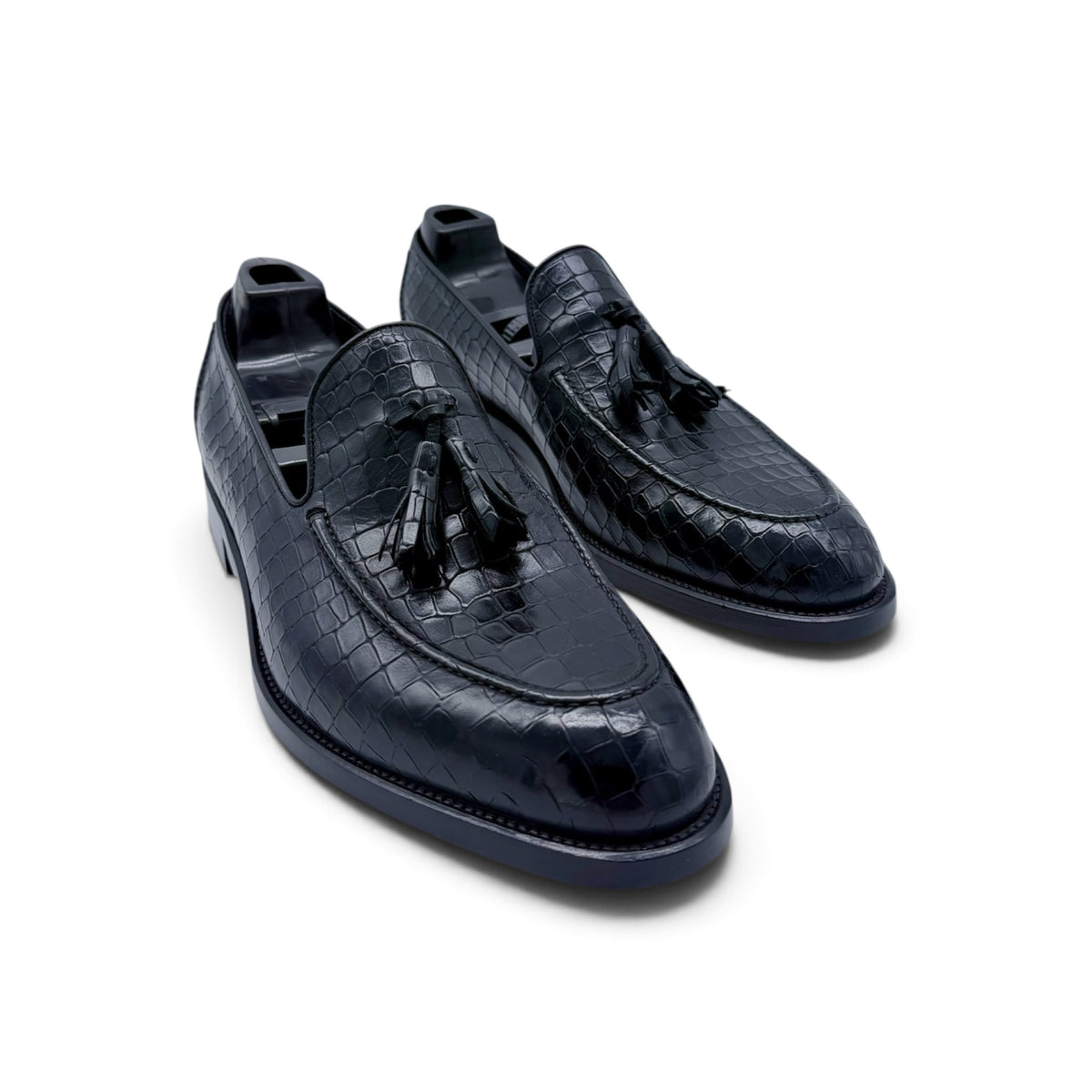 Mocassin Roberto Celk à pompon en cuir de crocodile noir