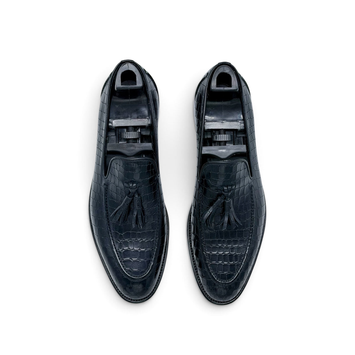 Mocassin Roberto Celk à pompon en cuir de crocodile noir